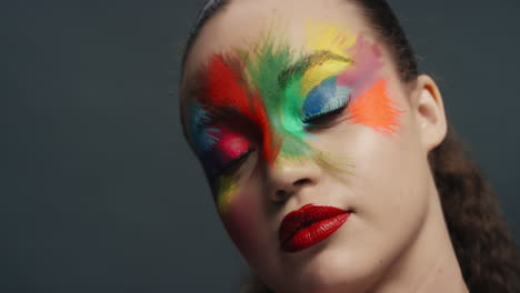 close up portrait beautiful woman wearing colorful face paint exotic multicolored body art sensual female enjoying creative expression