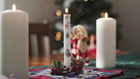 candles in a room decorated for christmas