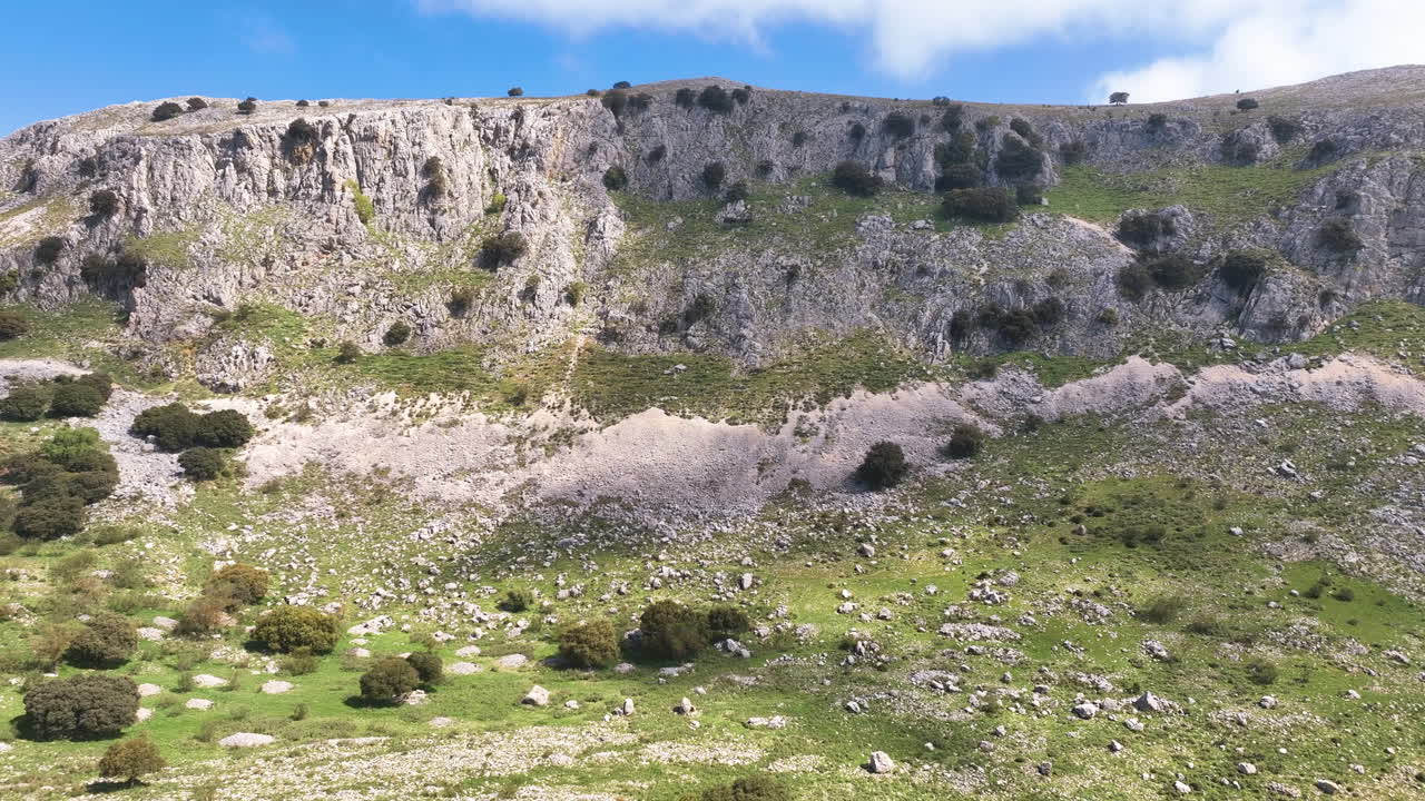 Flight close up to the picturesque craggy sides of Malaga's Axarquia mountains
