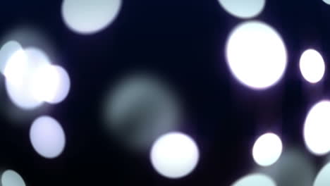 círculos brillantes de luz moviéndose en negro
