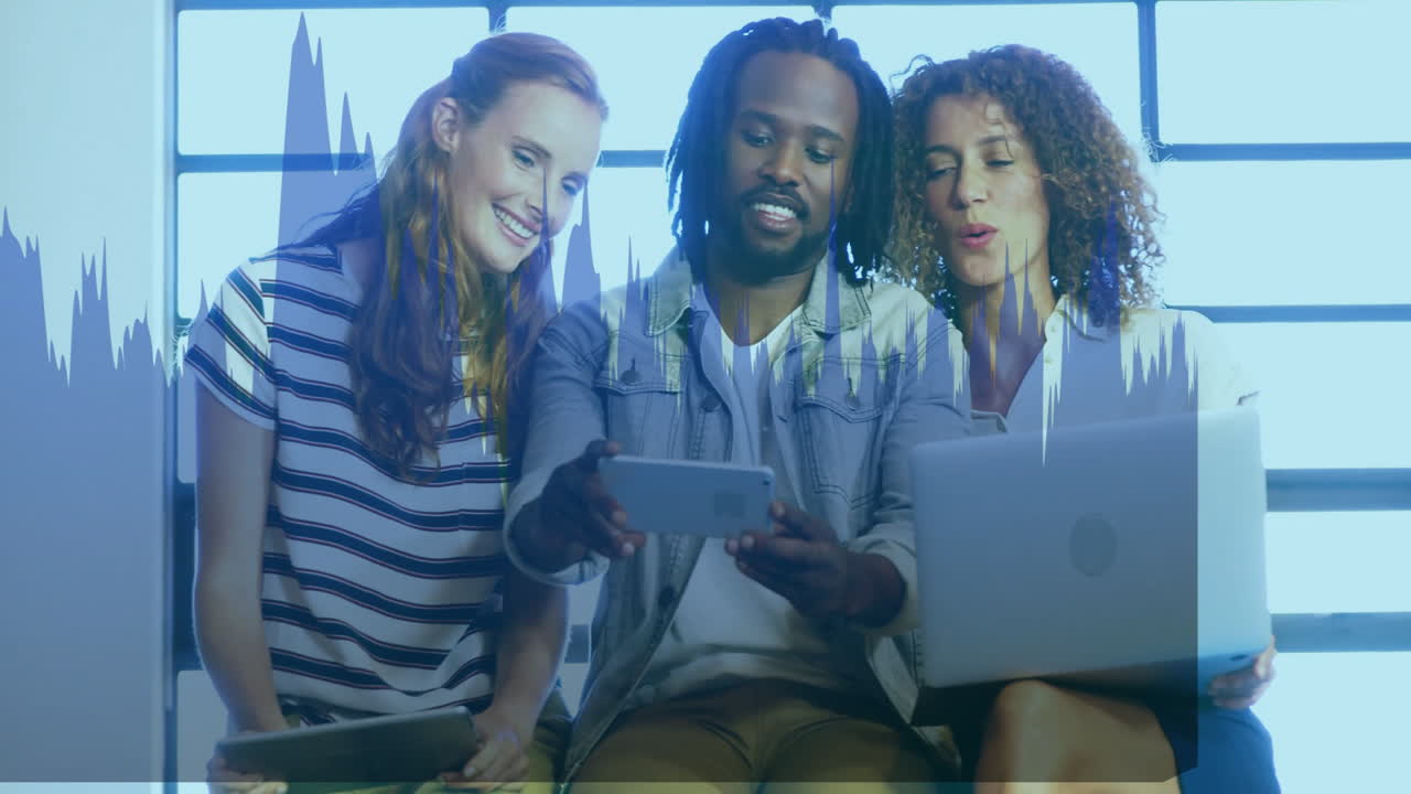 Diverse group using digital devices with financial data animation overlay