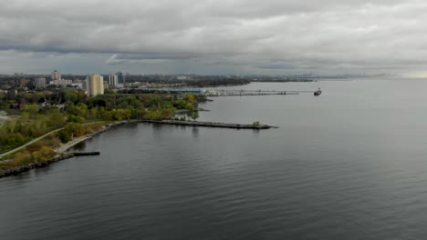 Flying-along-Mississauga-lakeshore-on-Lake-Ontario-on-an-overcast-summer-day