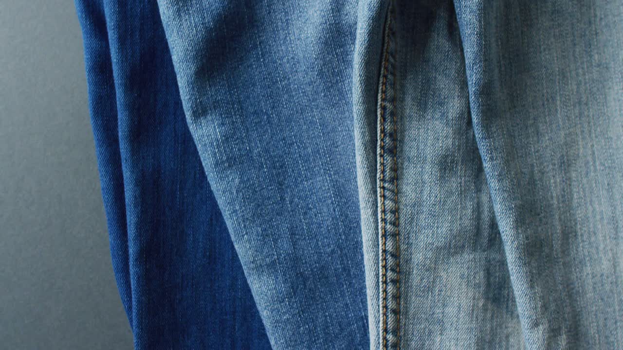 Close up of jeans with different shades with copy space