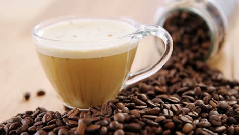 Cup-of-coffee-with-spilled-roasted-beans