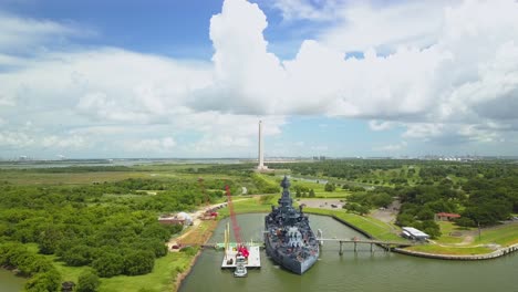 uss texas and the san jacinto battleground state historic park in the background