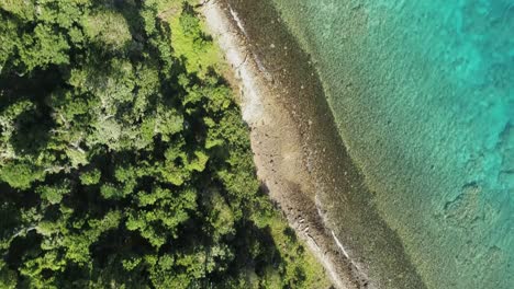 Aerial-footage-of-ocean-and-land-on-an-island-in-Tonga