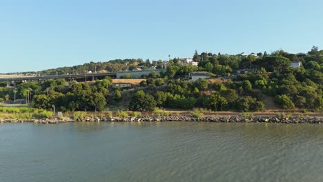 a left to right panning shot from a drone of the waterfront in crockett, california
