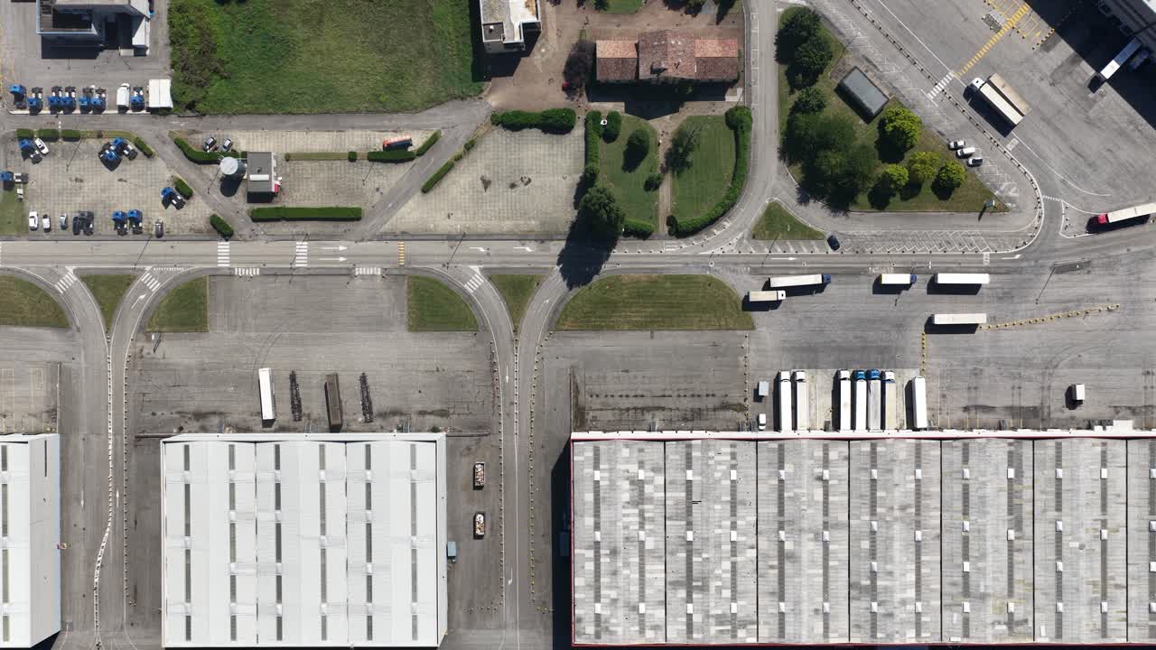 Logistics, parcel sorting, and transportation hub, drone views of industrial facility. Top down aerial