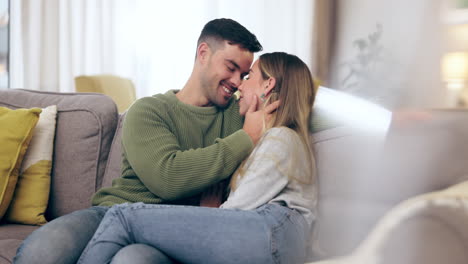 Couple,-love-and-nose-touch-on-home-sofa