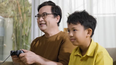 asian man and boy in the living room