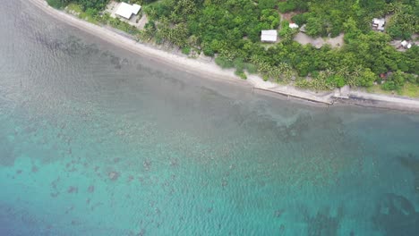 Aerial-dolly-side-shot-of-colorful-pacific-ocean-during-sunlight