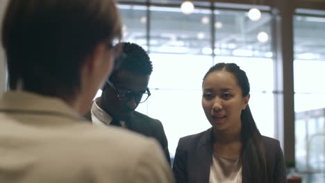 Businessman-And-Businesswoman-At-Hotel-Reception