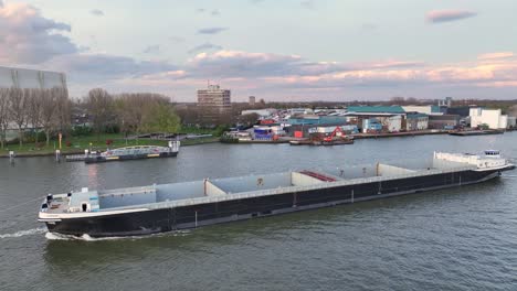 New-Building-Vessel-Sailing-In-Krimpen-aan-den-IJssel,-Netherlands---Aerial-Shot