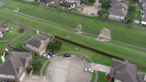 Aerial-of-middle-class-suburban-neighborhood-just-outside-of-Houston,-Texas