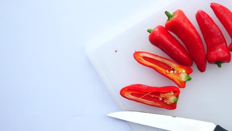 red bell peppers on a chopping board