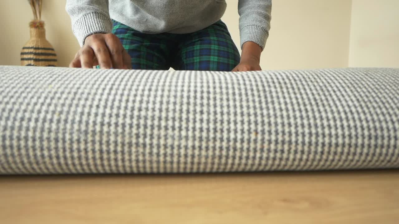 Rolling up a rug