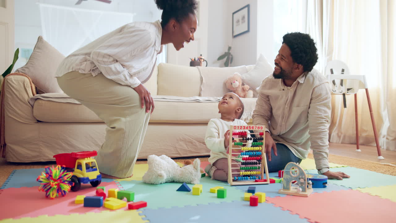 Happy family playing with baby and toys at home