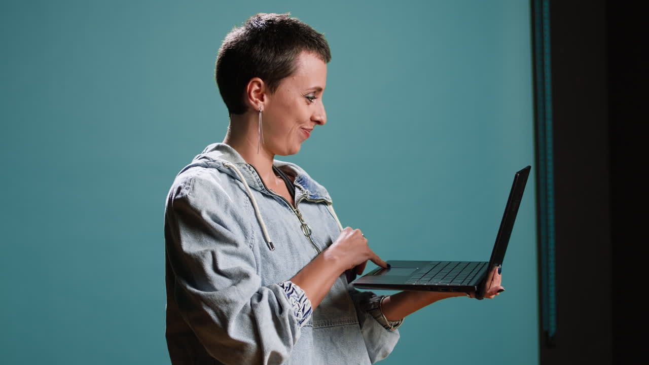Woman using laptop and credit card for online shopping