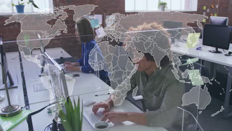 people working at office desks with world map animation overlay