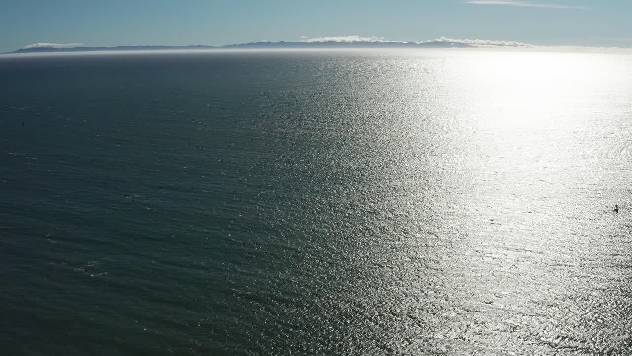 Wide tilting up aerial shot of the Channel Islands from Santa Barbara, California. 4K