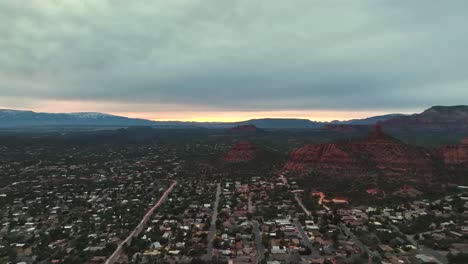 drone aerial sedona city and mountain landscape during sunset in arizona, united states