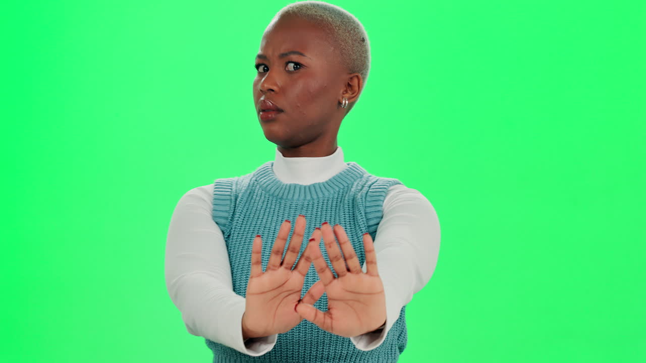 Woman Showing Stop Sign in Studio