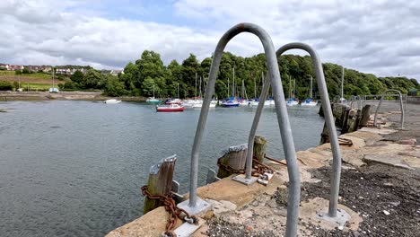 ladders and boats at a scenic dock