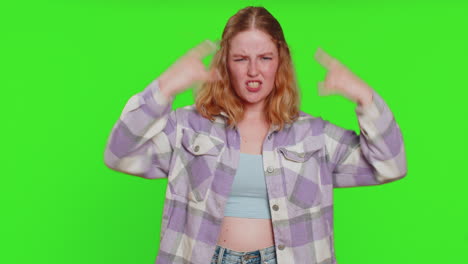 happy woman showing rock n roll gesture by hands cool sign crazy expression dancing victory win