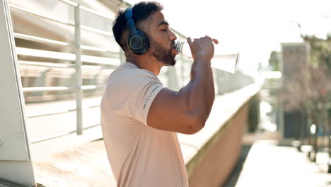 sports, man and drinking water in city for fitness