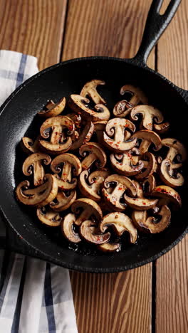 sautéed sliced mushrooms in a cast iron pan