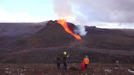 icelanders watch the massive eruption of fagradalsfjall volcano on the reykjanes peninsula in iceland