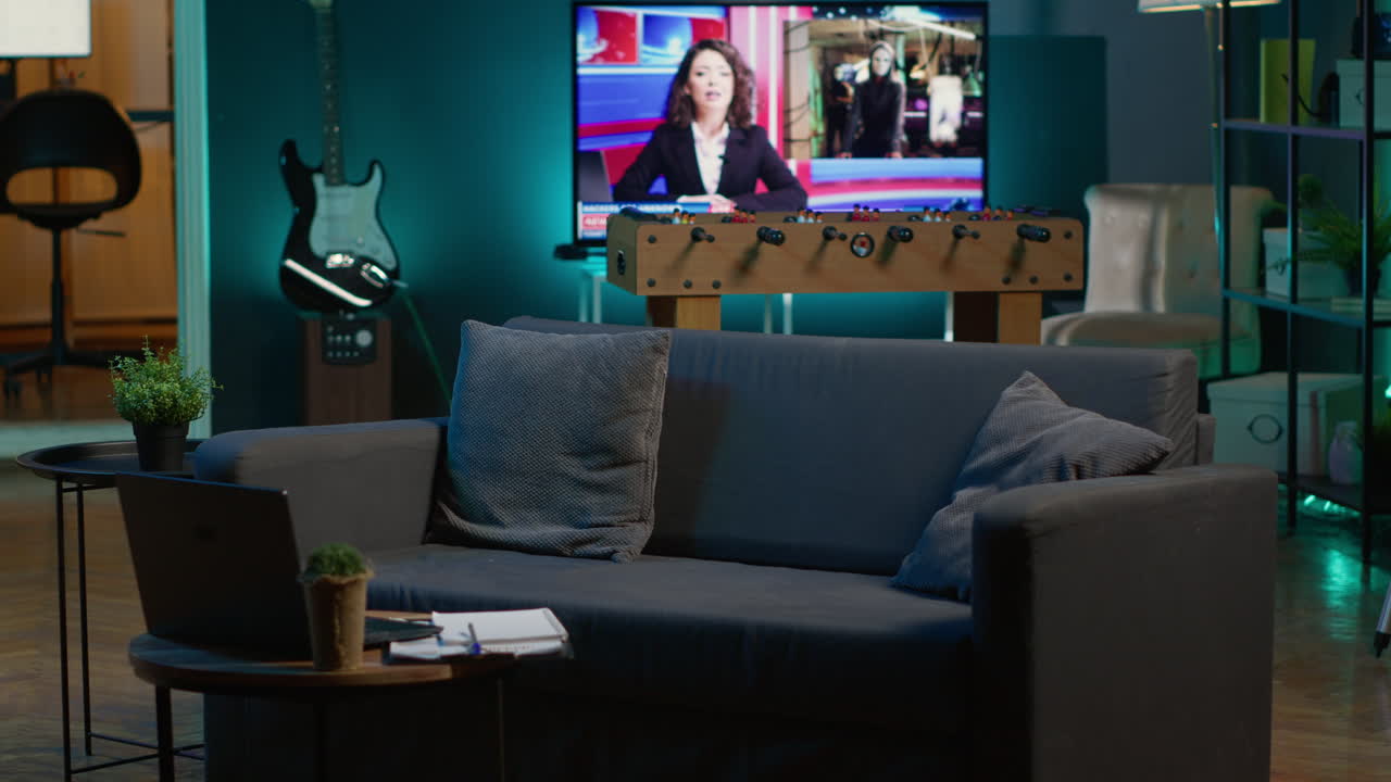 Empty contemporary apartment with trendy neon lights and a big smart tv, comfortable modern setup for a young man. Minimalist loft space decorated with indoor plants for a chill style.