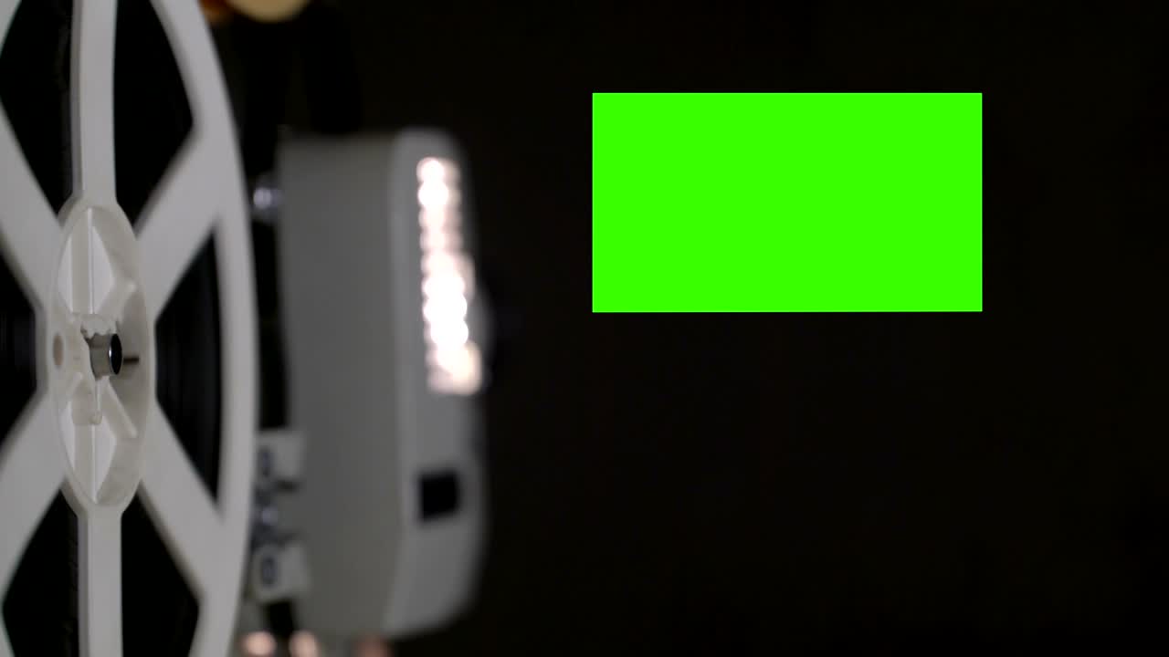 Film projector 19 x 9 aspect ratio chroma key green screen natural dust and hairs. Loop
