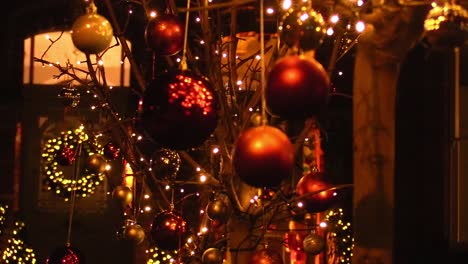 centre close up of chrismas decoration blowing in the wind in december outside and irish house in dublin out of focus