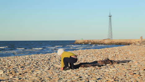 Little-boy-on-pebble-beach