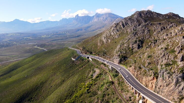 Car traffic flows on dangerous Sir Lowry's pass along Hottentots Holland, aerial