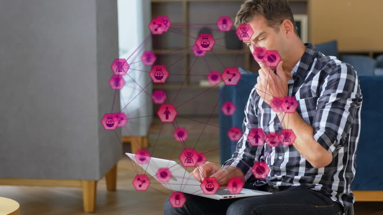 animación de un globo de iconos digitales sobre un hombre caucásico pensativo usando una computadora portátil en la oficina