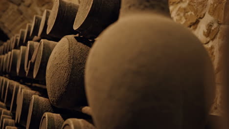 aged, dusty bottles in a historic wine cellar