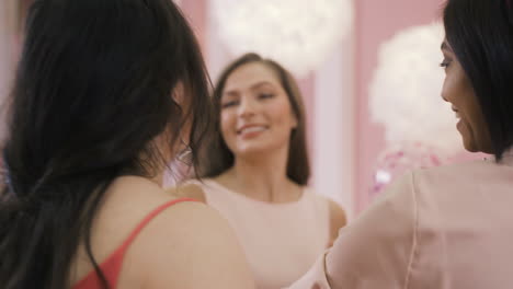 close up view of a bachelor girl hugging and kissins her friends in her bachelorette party