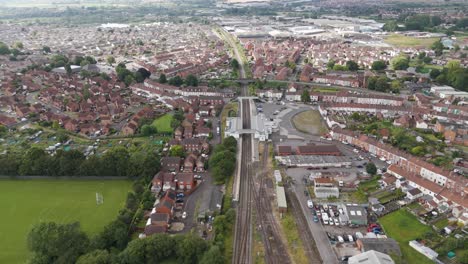 aerial view of a suburban town with railway tracks and residential areas