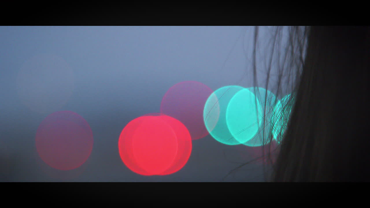 Bokeh lights seen through car windscreen