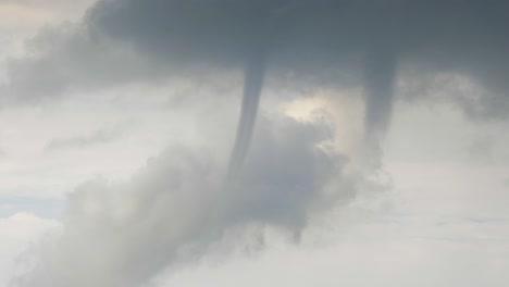 Waterspout-funnel-forming-in-the-sky