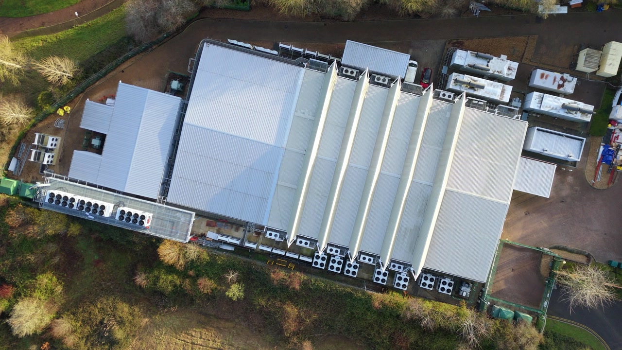 Drone view of the external power and cooling components of a massive British AI data center.