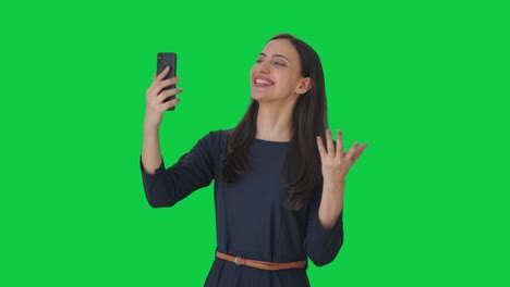 Happy-Indian-girl-talking-on-video-call-Green-screen