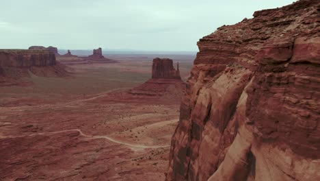 a spectacular 4k drone shot of the towering mittens and merrick buttes in the oljato monument valley, part of the navajo nation and located on the arizona side of the arizona-utah border, usa