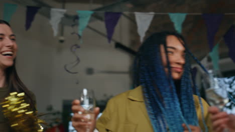 dancing friends relaxing birthday party close up. multiethnic people celebrating