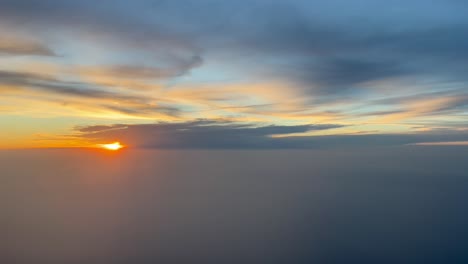Pilot-view-of-a-nice-orange-sunset-over-the-Mediterranean-Sea-approaching-to-Mallorca-Island,-Spain