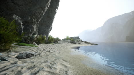 tranquil mountain lake with a sandy beach