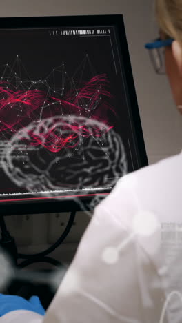 animation of human brain spinning over female scientist using computer