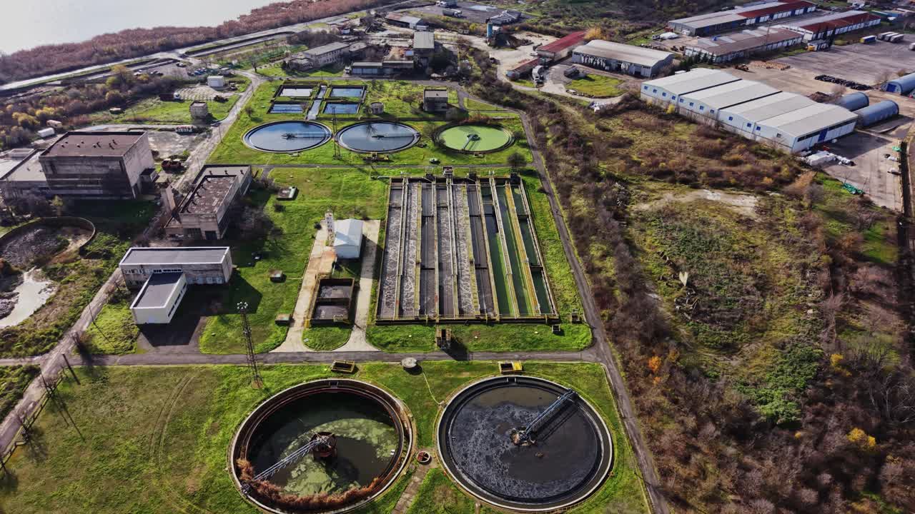 Water treatment facility showing tanks and processing areas in daylight